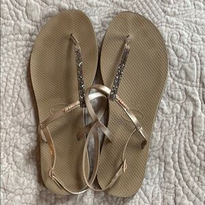 EUC Havaianas gold flip flops.